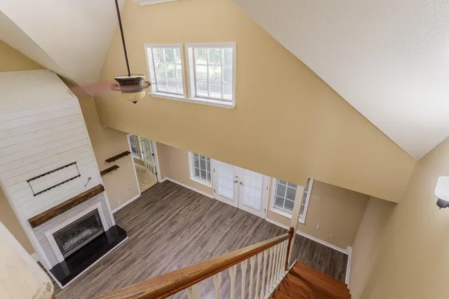 a view of an entryway with wooden floor