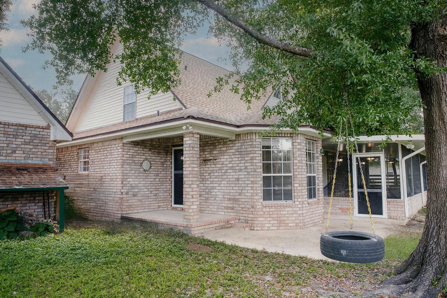329 Skyline Circle Crestview, FL 32539 - Photo 25 of 28 a front view of a house with garden