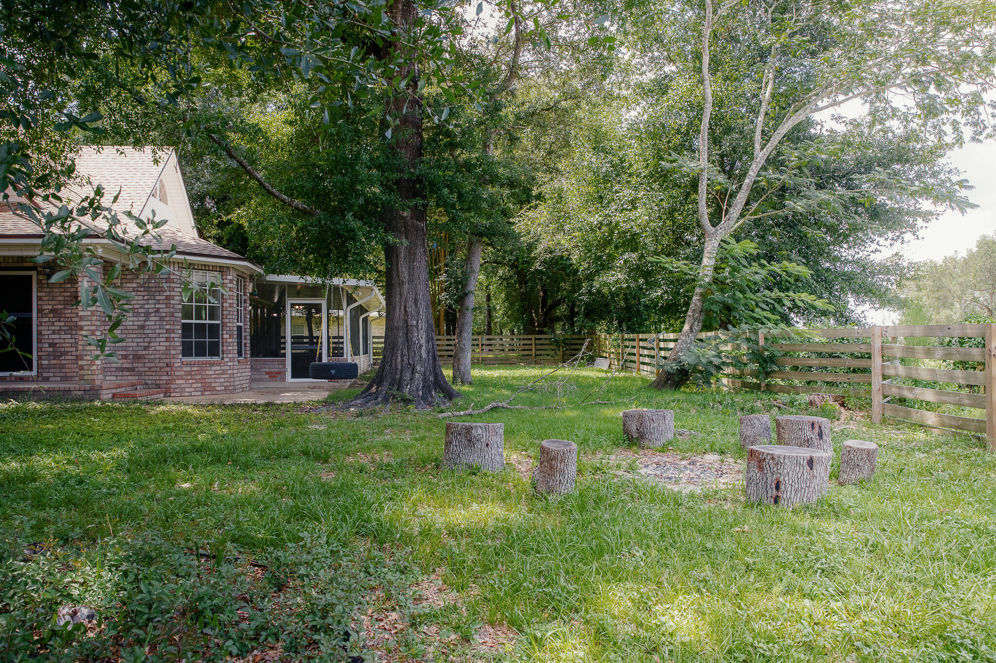 329 Skyline Circle Crestview, FL 32539 - Photo 26 of 28 a view of backyard with a table and a chairs