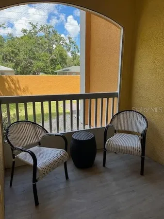 a balcony with a couch