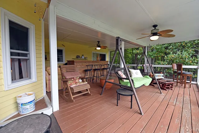 a view of an empty room with a fireplace and a floor to ceiling window