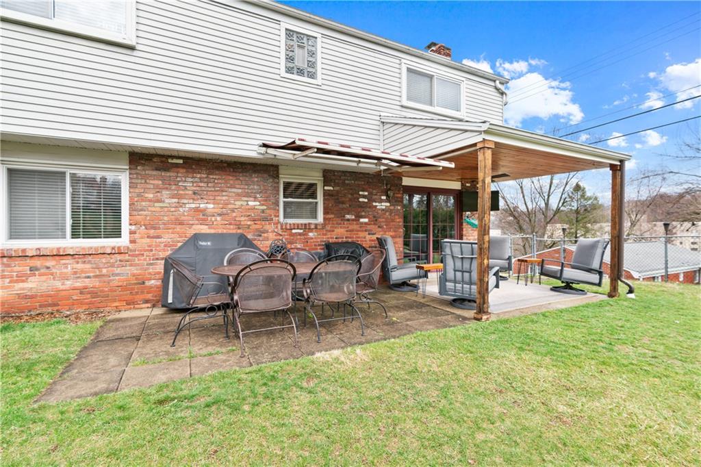 5140 Raintree Drive Pittsburgh, PA 15236 - Photo 23 of 26 a backyard of a house with table and chairs