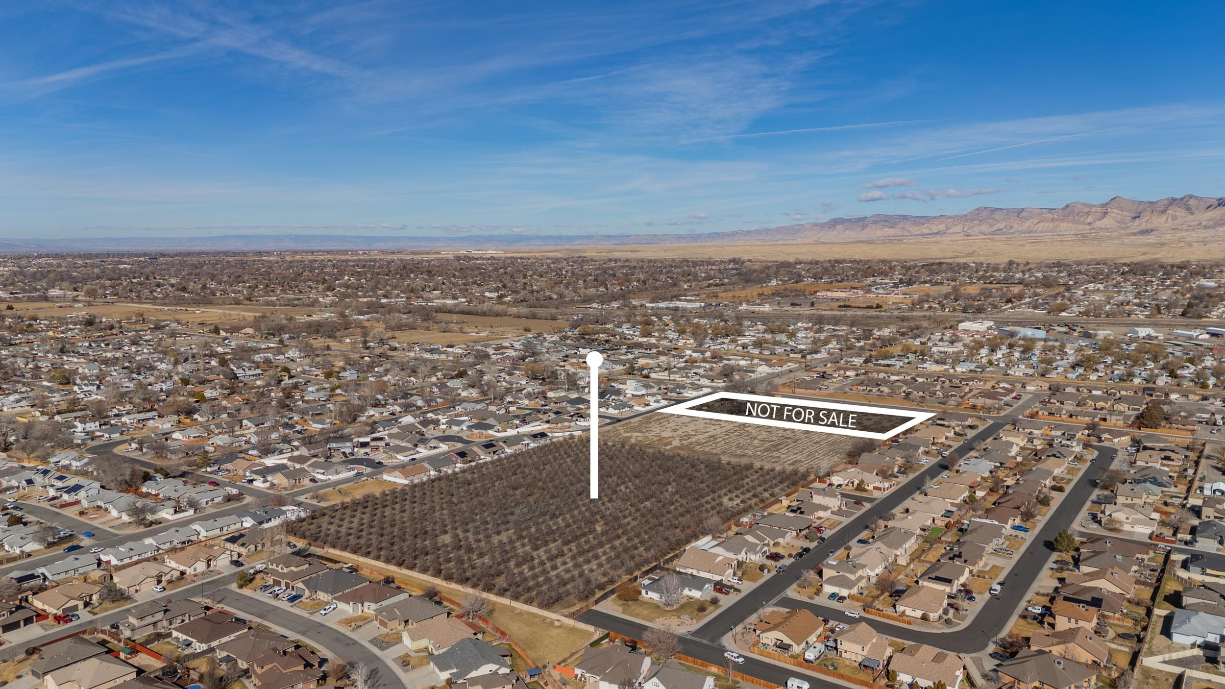 3153 E Road Grand Junction, CO 81504 - Photo 17 of 19 an aerial view of a residential apartment building with a city view