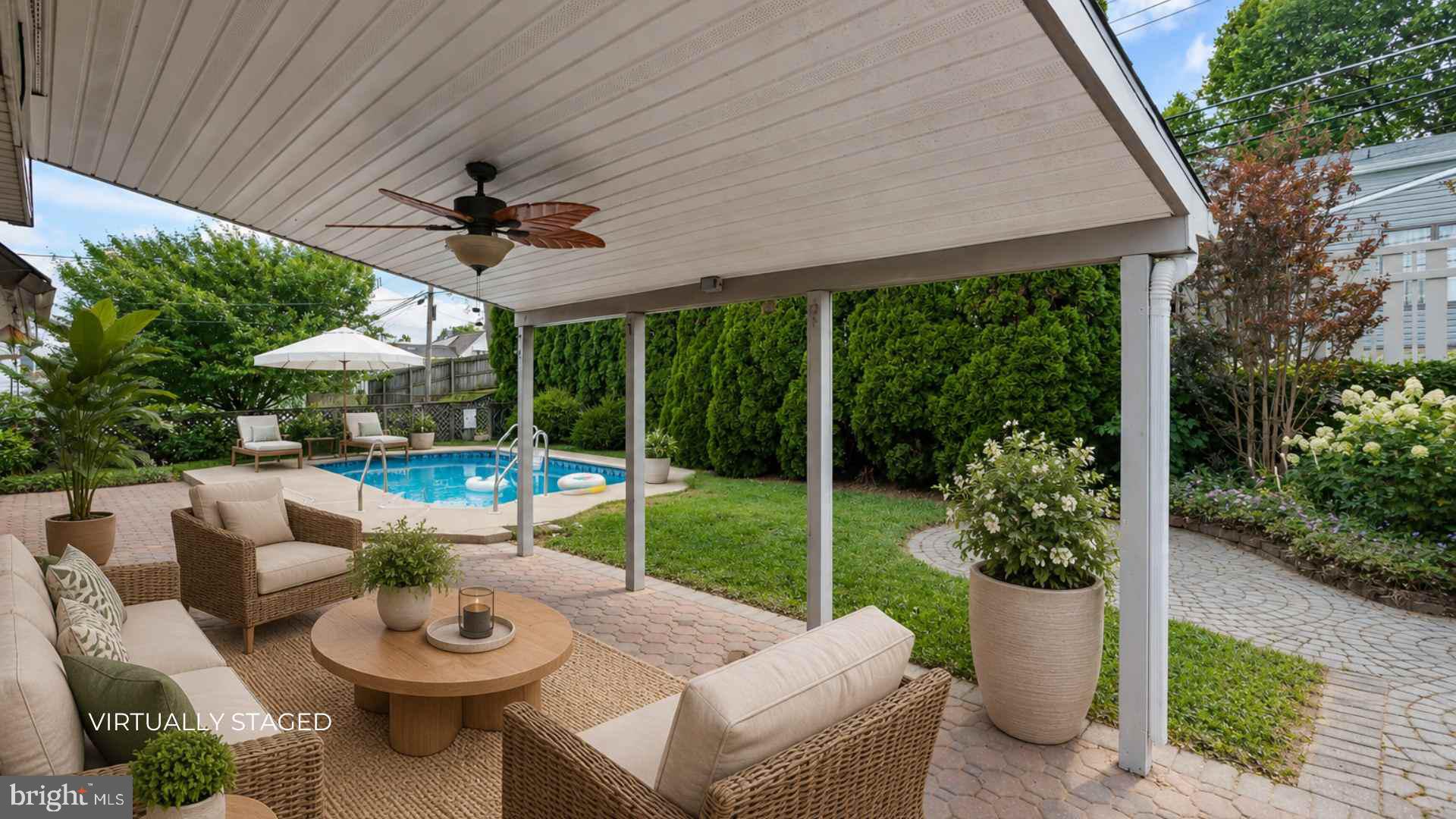 23 Cotton Road Levittown, PA 19057 - Photo 27 of 36 a view of a patio with a dining table and chairs