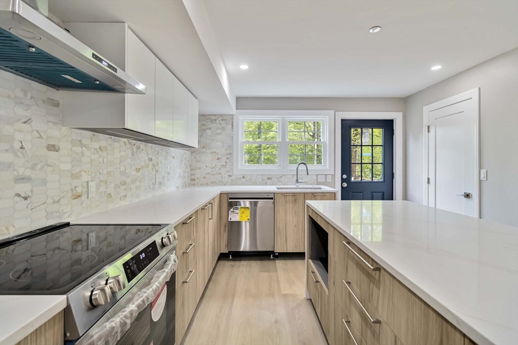 192 Main Street, Unit D Medway, MA 02053 - Photo 11 of 39 a kitchen with counter top space and windows