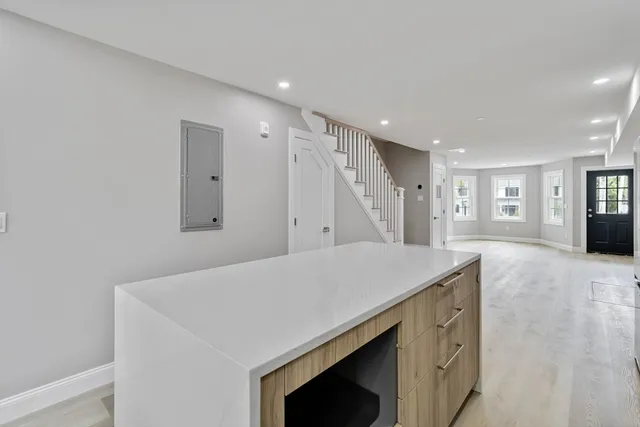 a kitchen with a stove a refrigerator and a sink