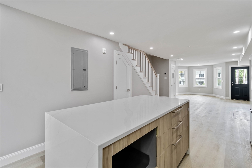192 Main Street, Unit D Medway, MA 02053 - Photo 15 of 39 a kitchen with a stove a refrigerator and a sink