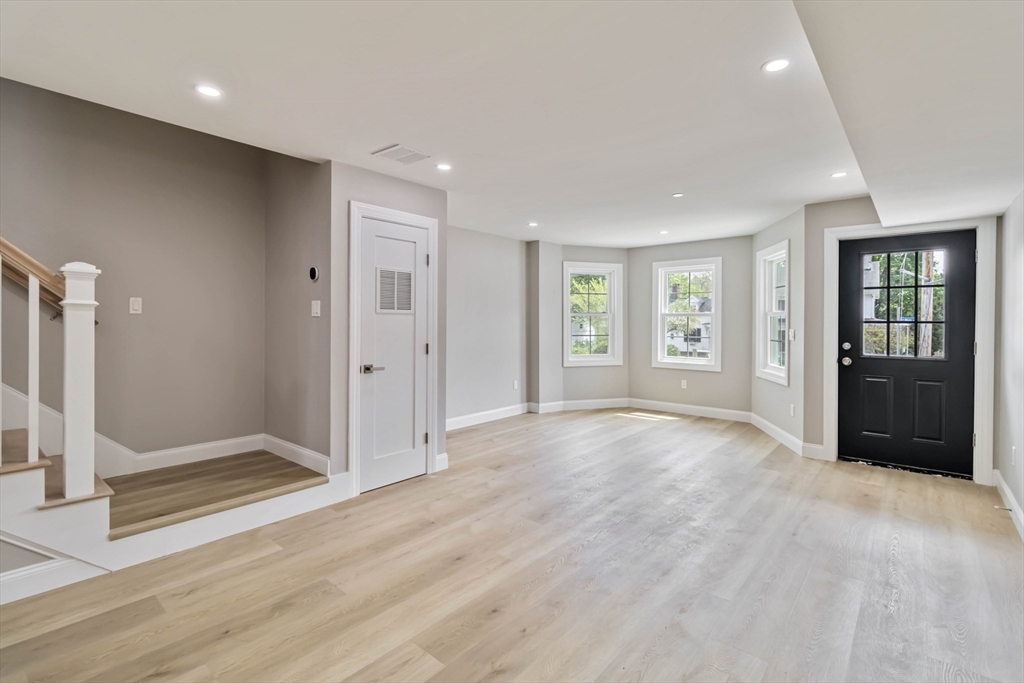 192 Main Street, Unit D Medway, MA 02053 - Photo 18 of 39 an empty room with windows and closet