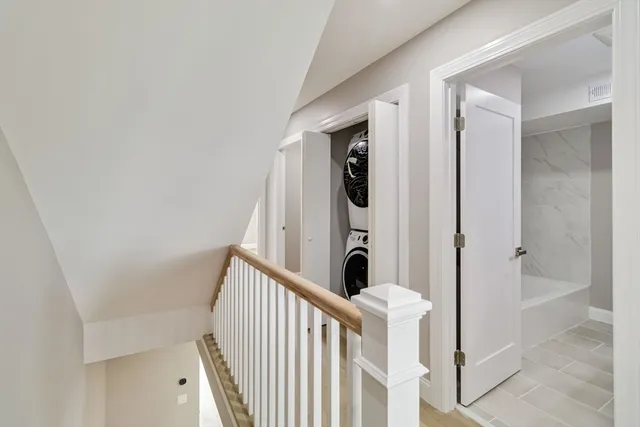 a view of a hallway with washer and dryer