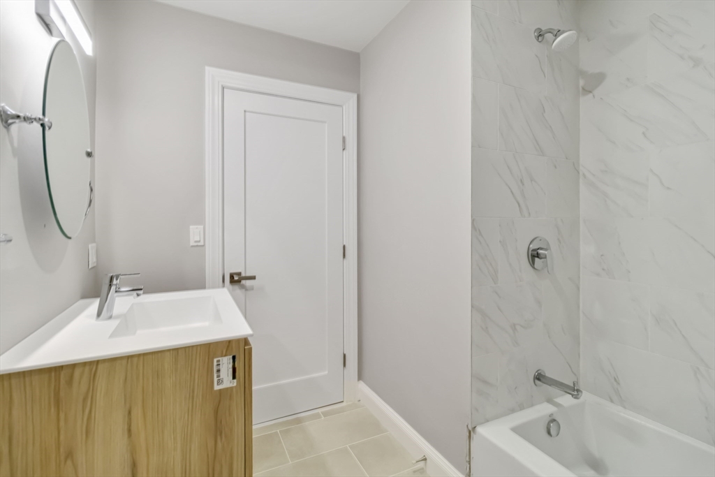 192 Main Street, Unit D Medway, MA 02053 - Photo 25 of 39 a bathroom with a sink a toilet and shower