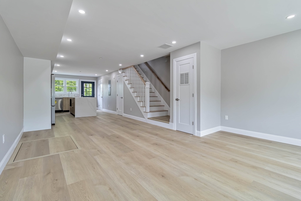 192 Main Street, Unit D Medway, MA 02053 - Photo 6 of 39 a view of an empty room with wooden floor