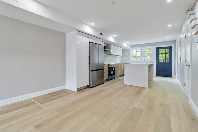 a view of kitchen with refrigerator stove microwave and refrigerator