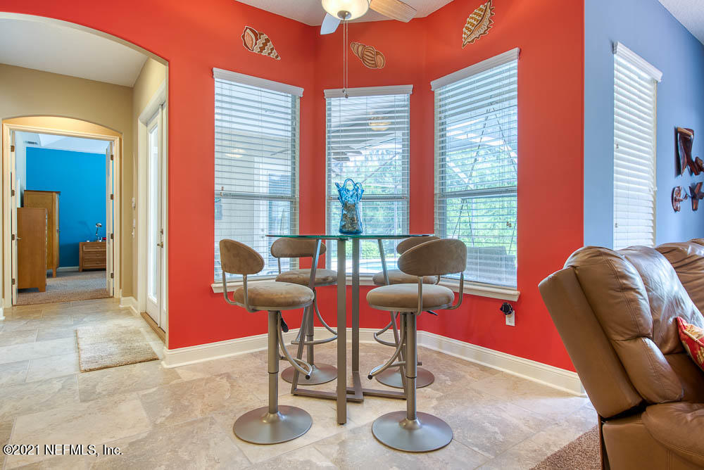 11590 Mandarin Road Jacksonville, FL 32223 - Photo 11 of 46 a living room with furniture and a large window