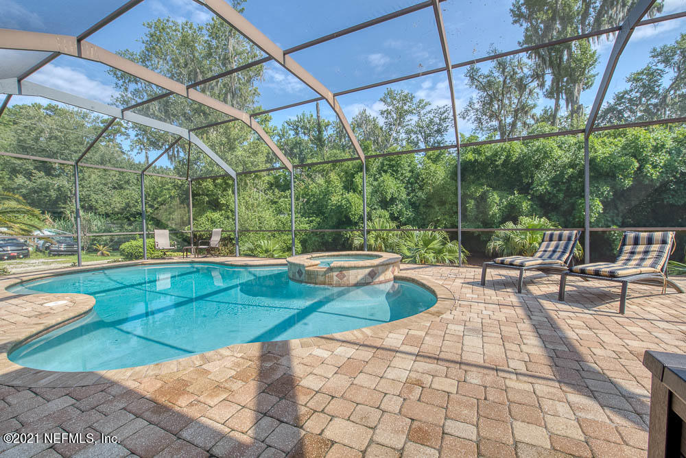 11590 Mandarin Road Jacksonville, FL 32223 - Photo 13 of 46 a view of a swimming pool with a patio