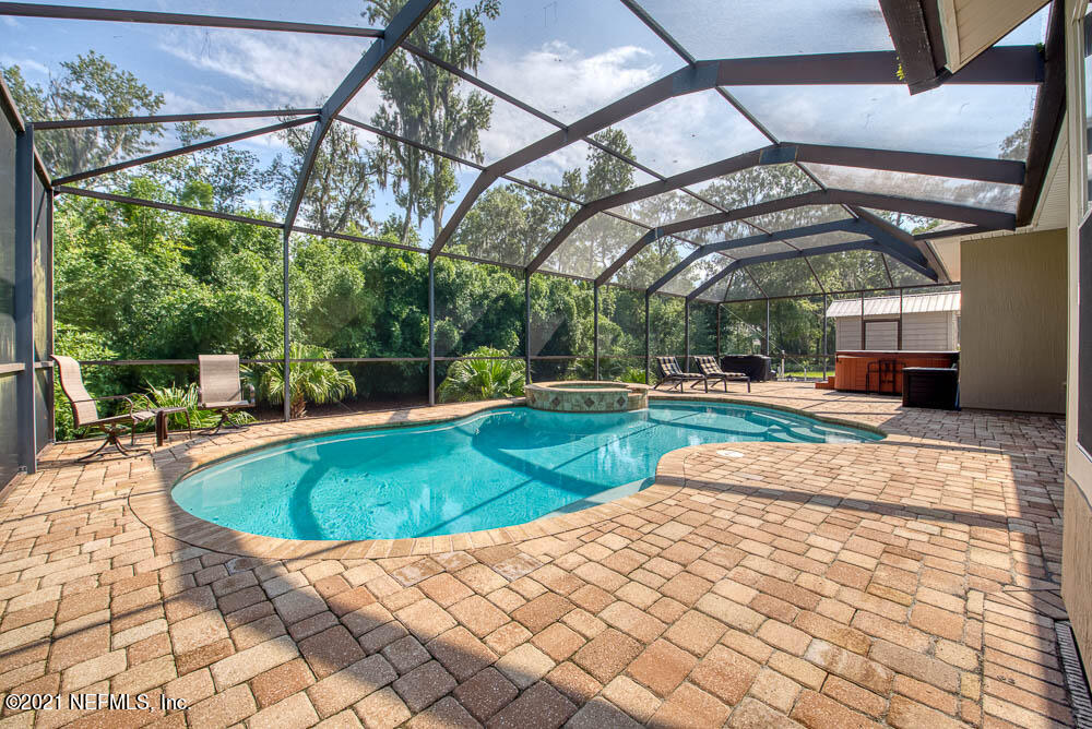11590 Mandarin Road Jacksonville, FL 32223 - Photo 14 of 46 a view of a swimming pool with a patio