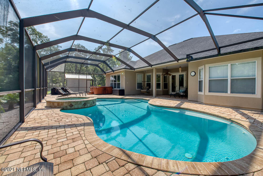 11590 Mandarin Road Jacksonville, FL 32223 - Photo 15 of 46 a view of a swimming pool with a patio
