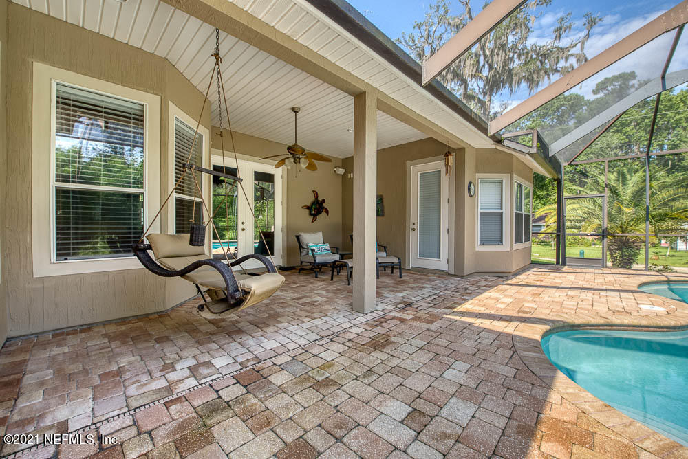 11590 Mandarin Road Jacksonville, FL 32223 - Photo 16 of 46 a view of a house with backyard porch and sitting area