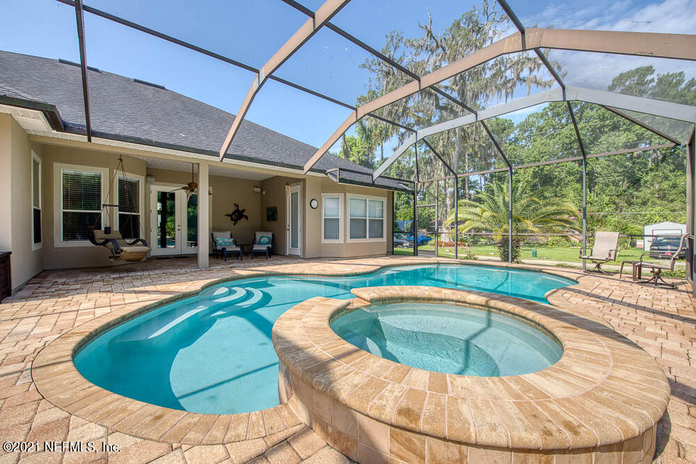 11590 Mandarin Road Jacksonville, FL 32223 - Photo 2 of 46 a view of a house with swimming pool