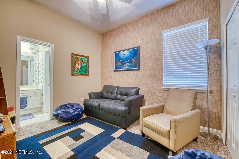 11590 Mandarin Road Jacksonville, FL 32223 - Photo 27 of 46 a living room with furniture and a window