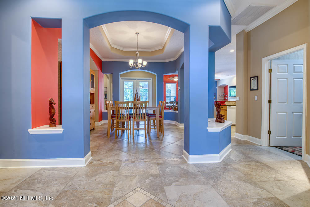 11590 Mandarin Road Jacksonville, FL 32223 - Photo 3 of 46 a view of a dining room with furniture