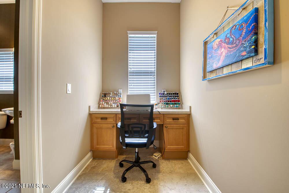 11590 Mandarin Road Jacksonville, FL 32223 - Photo 31 of 46 a view of a workspace with furniture and a window