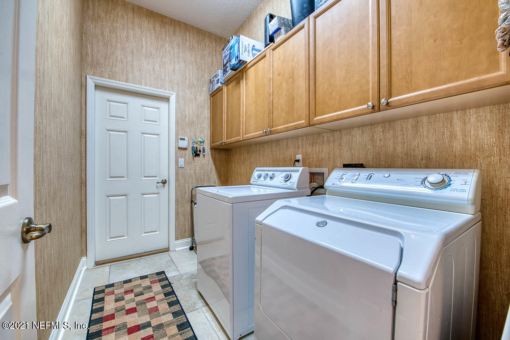 11590 Mandarin Road Jacksonville, FL 32223 - Photo 34 of 46 a utility room with dryer and washer