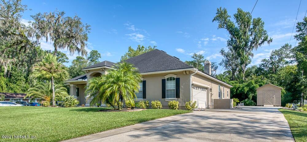 11590 Mandarin Road Jacksonville, FL 32223 - Photo 35 of 46 a view of a house with a yard