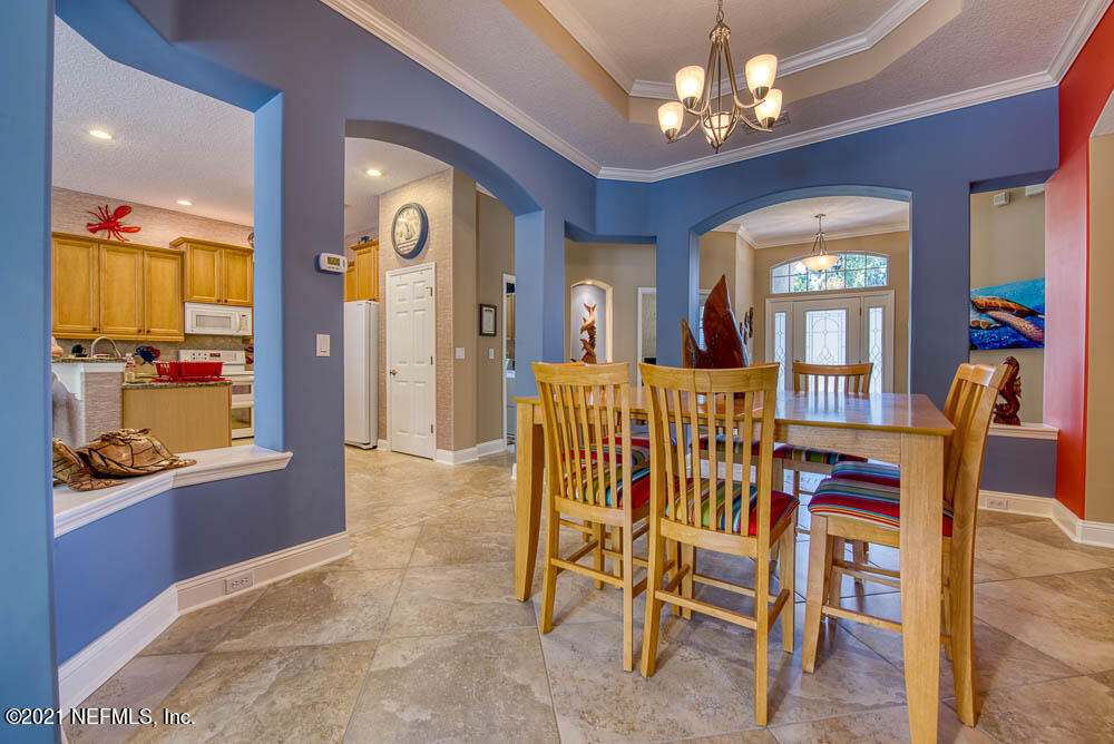 11590 Mandarin Road Jacksonville, FL 32223 - Photo 4 of 46 a view of a dining room with furniture window and wooden floor