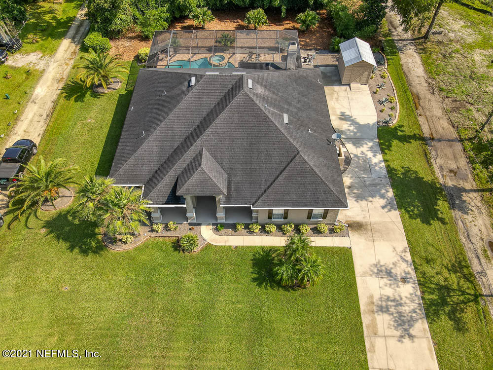 11590 Mandarin Road Jacksonville, FL 32223 - Photo 44 of 46 a aerial view of a house with swimming pool and large trees