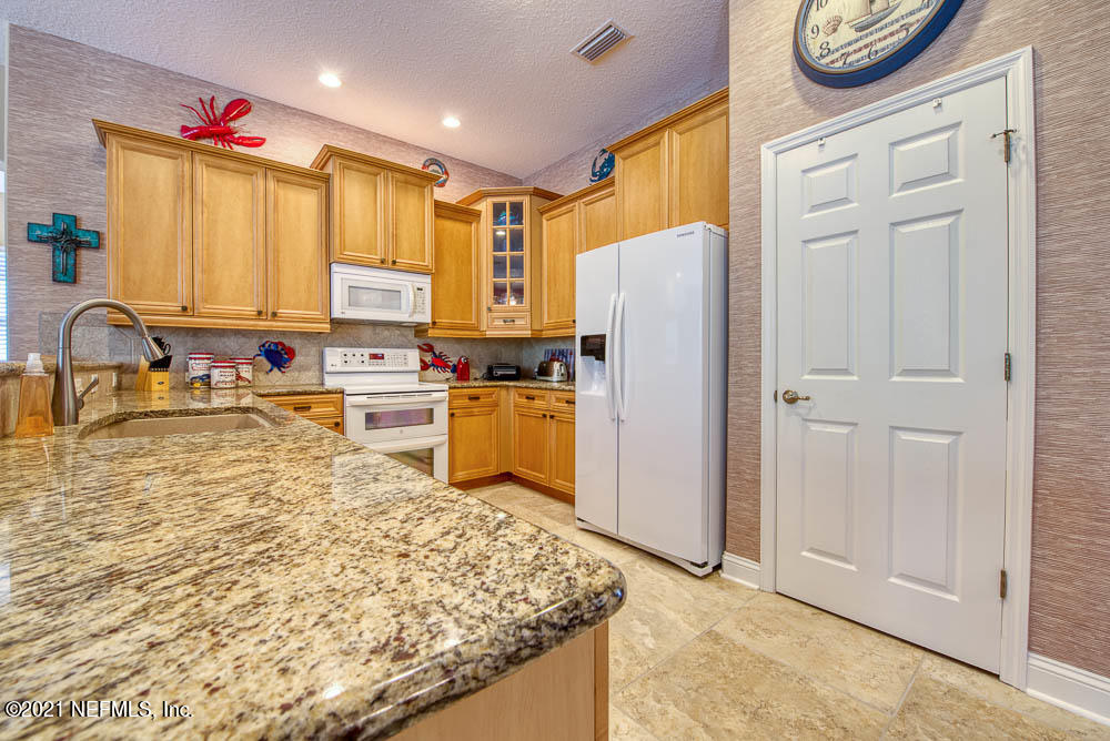 11590 Mandarin Road Jacksonville, FL 32223 - Photo 8 of 46 a kitchen with stainless steel appliances granite countertop a refrigerator sink and cabinets