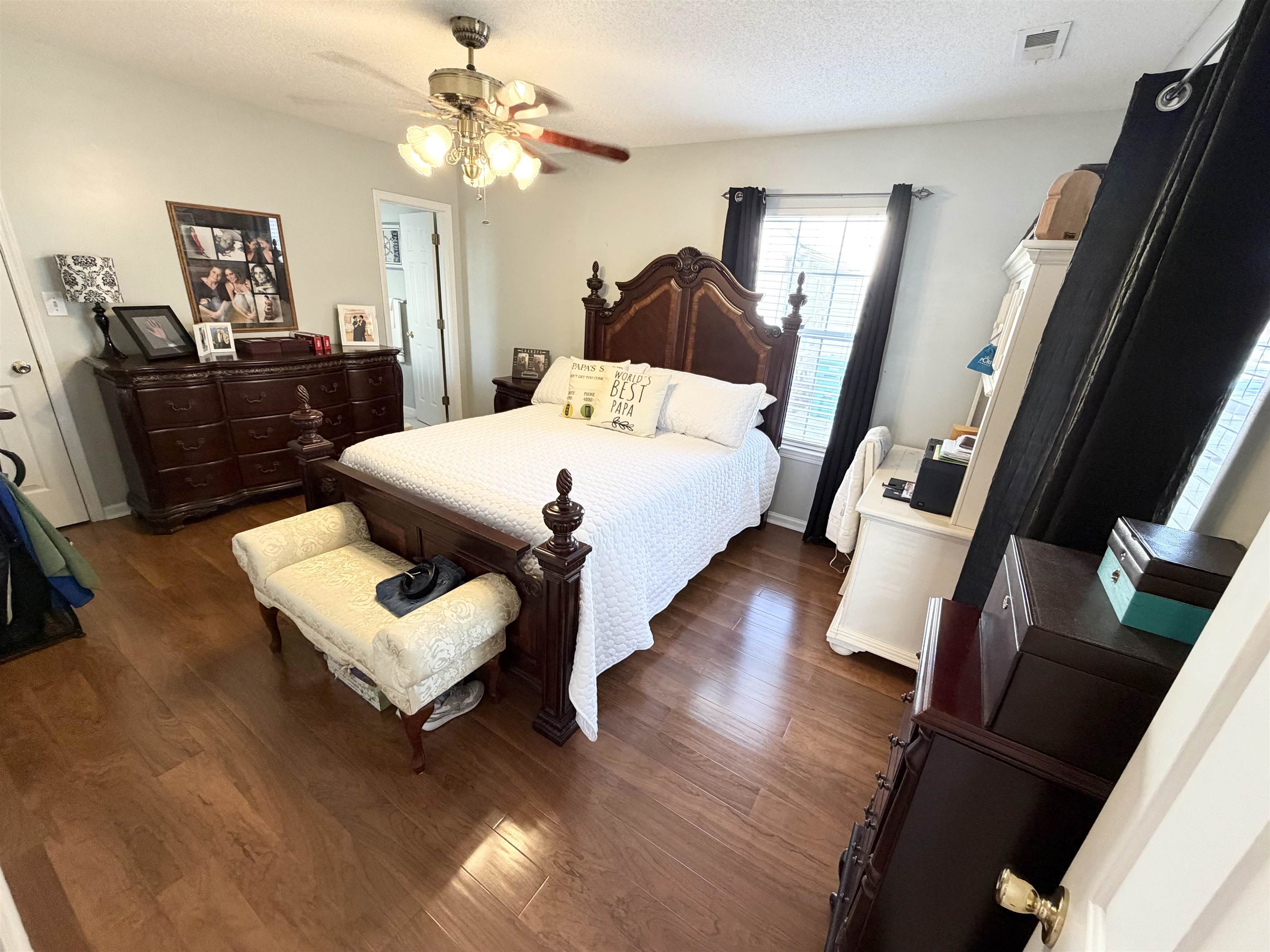 106 Sly Fox Trail Myrtle Beach, SC 29588 - Photo 7 of 14 Bedroom with a textured ceiling, dark wood-style floors, and a ceiling fan
