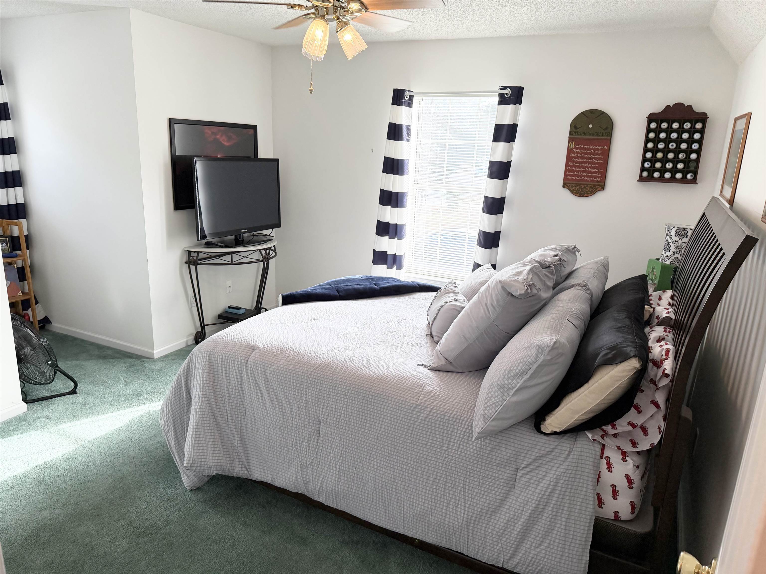 106 Sly Fox Trail Myrtle Beach, SC 29588 - Photo 10 of 14 Bedroom featuring carpet flooring, ceiling fan, and a textured ceiling