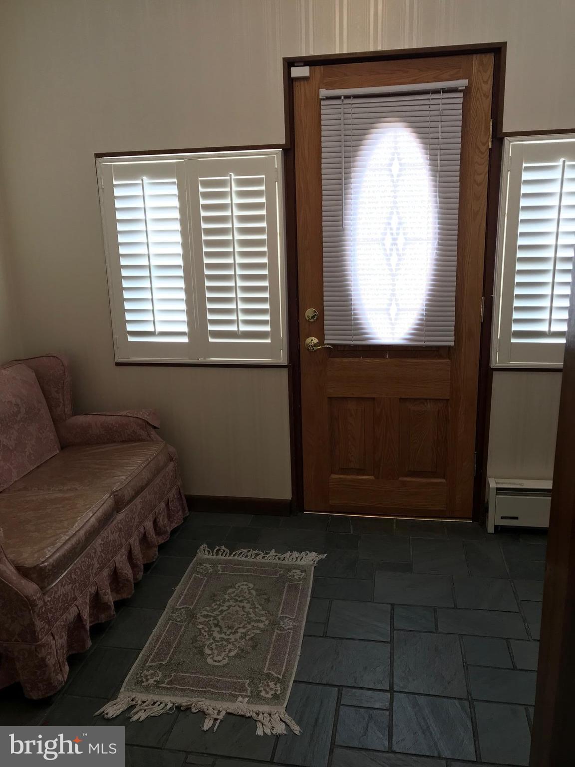 1831 Portship Road Baltimore, MD 21222 - Photo 2 of 17 a living room with furniture and a window