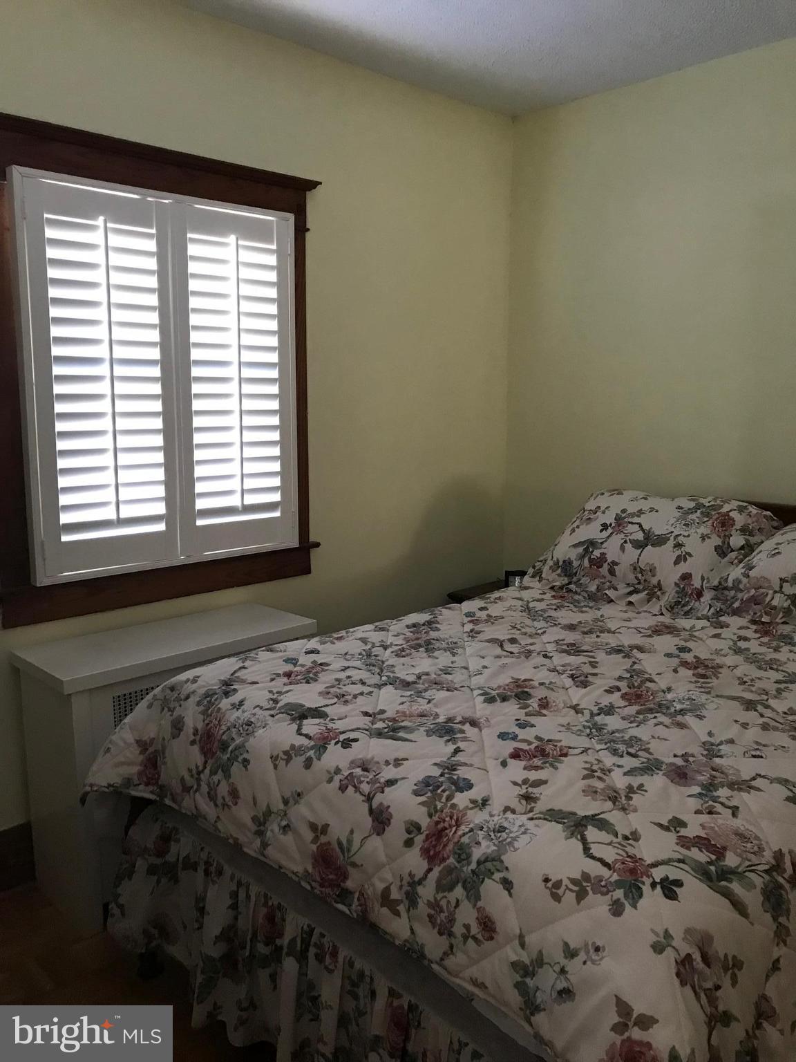 1831 Portship Road Baltimore, MD 21222 - Photo 13 of 17 a bedroom with a bed and a window