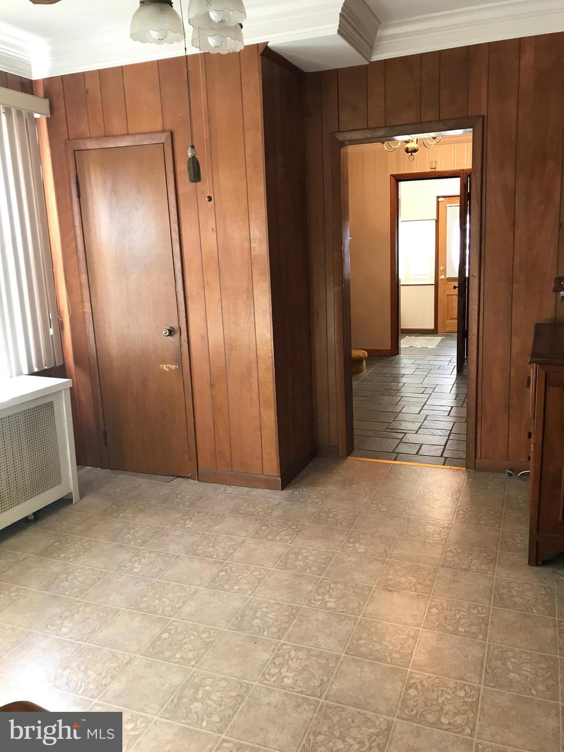 1831 Portship Road Baltimore, MD 21222 - Photo 8 of 17 an empty room with windows and closet