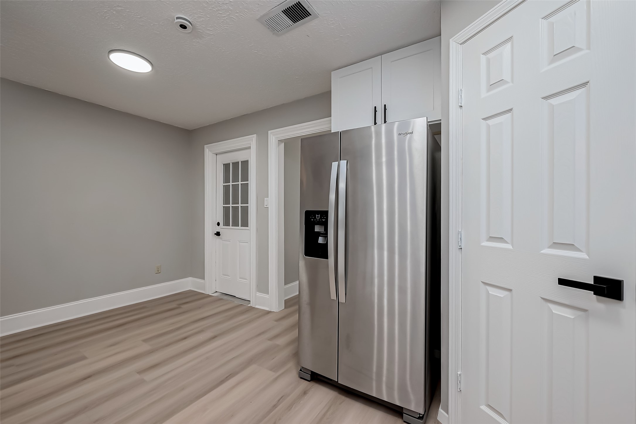 23227 Pine Post Lane Spring, TX 77373 - Photo 14 of 40 a view of an empty room with wooden floor and a window