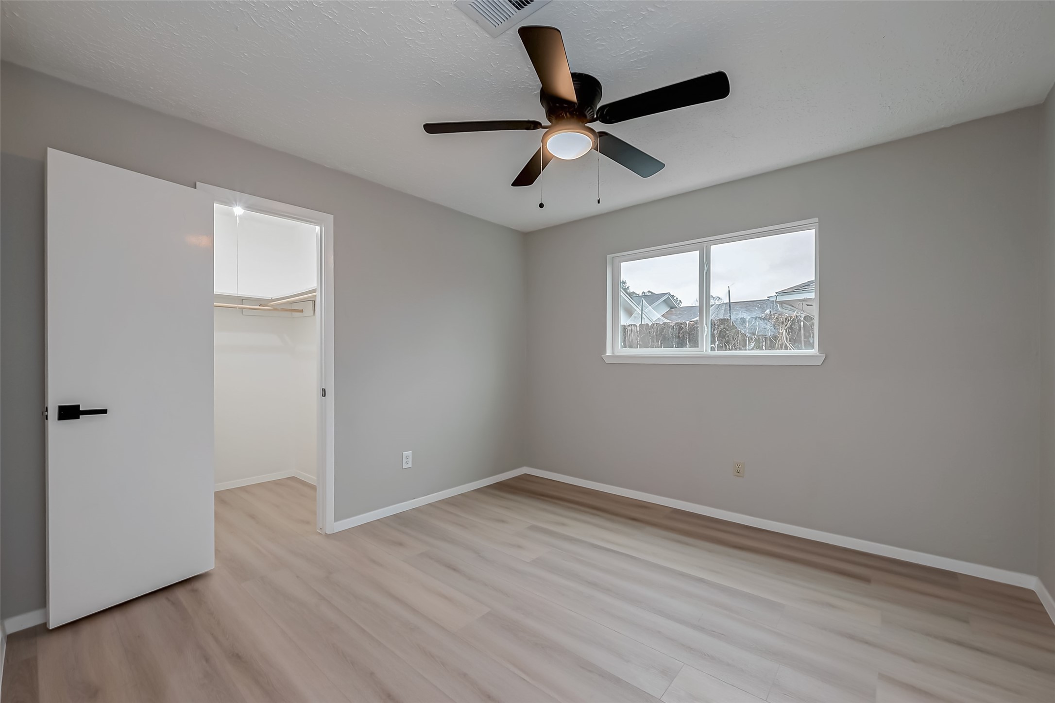 23227 Pine Post Lane Spring, TX 77373 - Photo 18 of 40 wooden floor in an empty room with a window