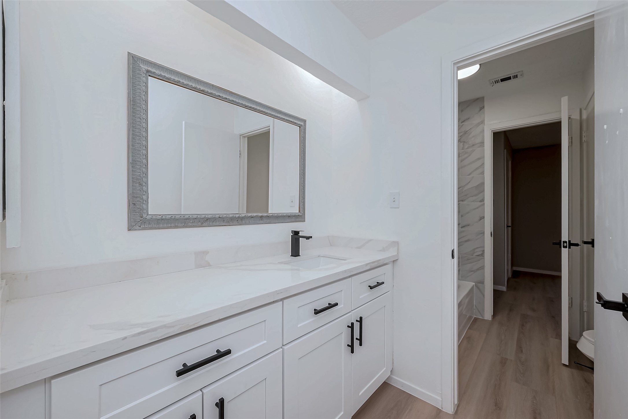 23227 Pine Post Lane Spring, TX 77373 - Photo 19 of 40 a bathroom with a sink and a mirror