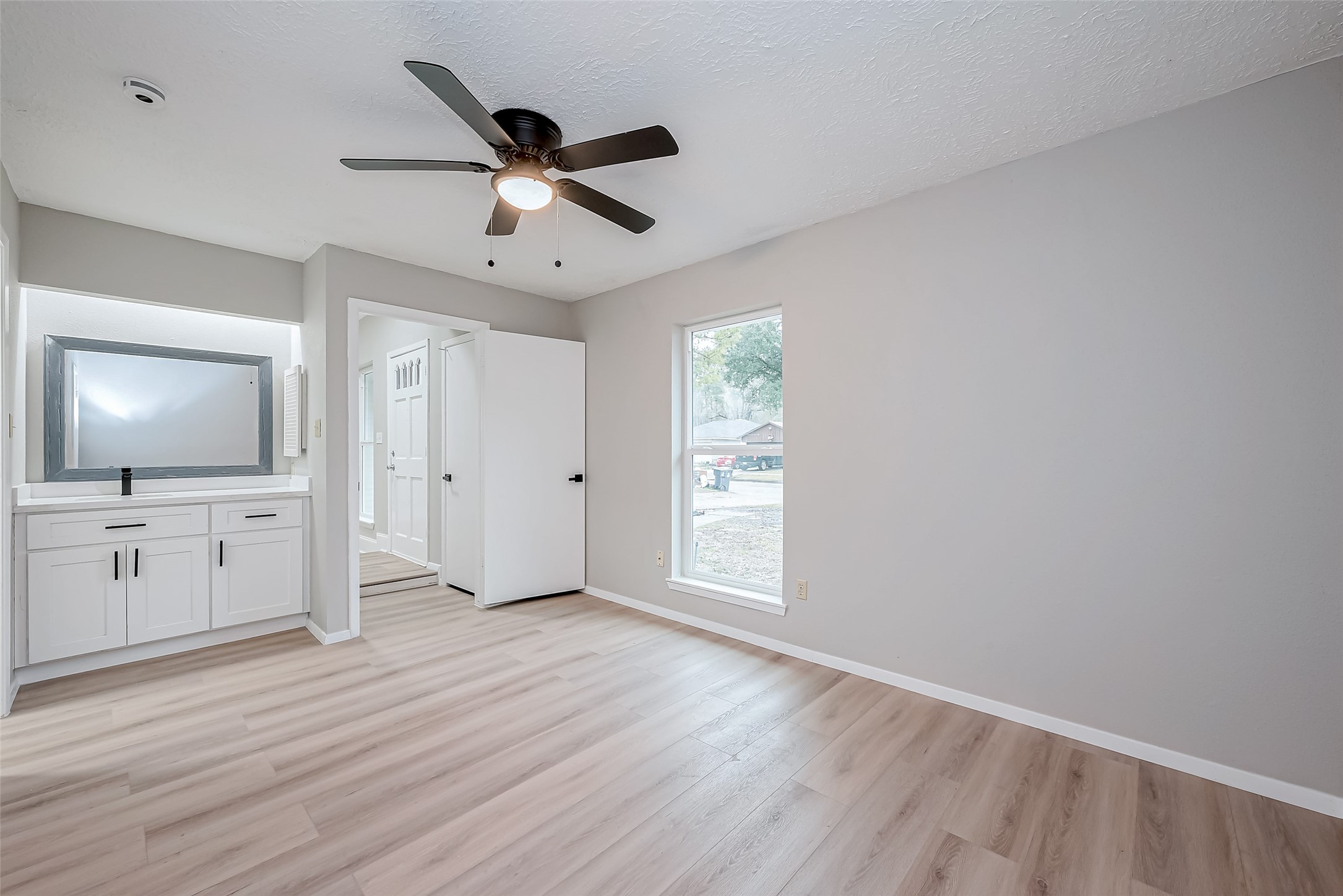 23227 Pine Post Lane Spring, TX 77373 - Photo 24 of 40 wooden floor in an empty room with a window