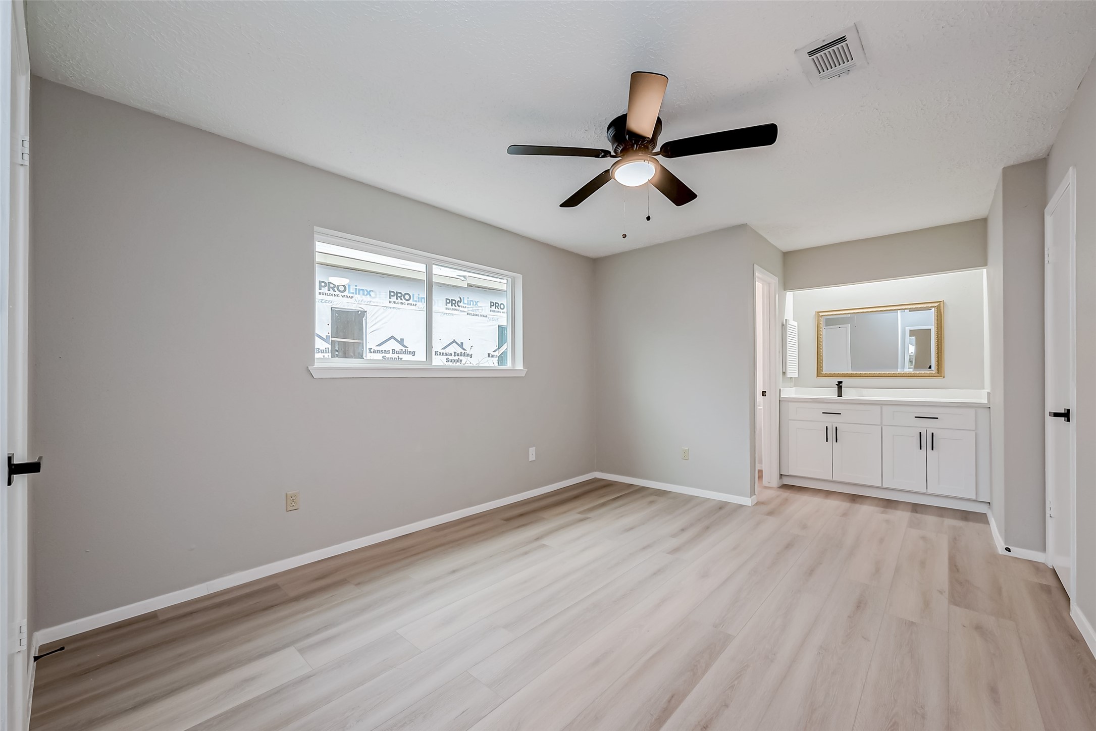 23227 Pine Post Lane Spring, TX 77373 - Photo 25 of 40 a view of empty room with wooden floor and fan