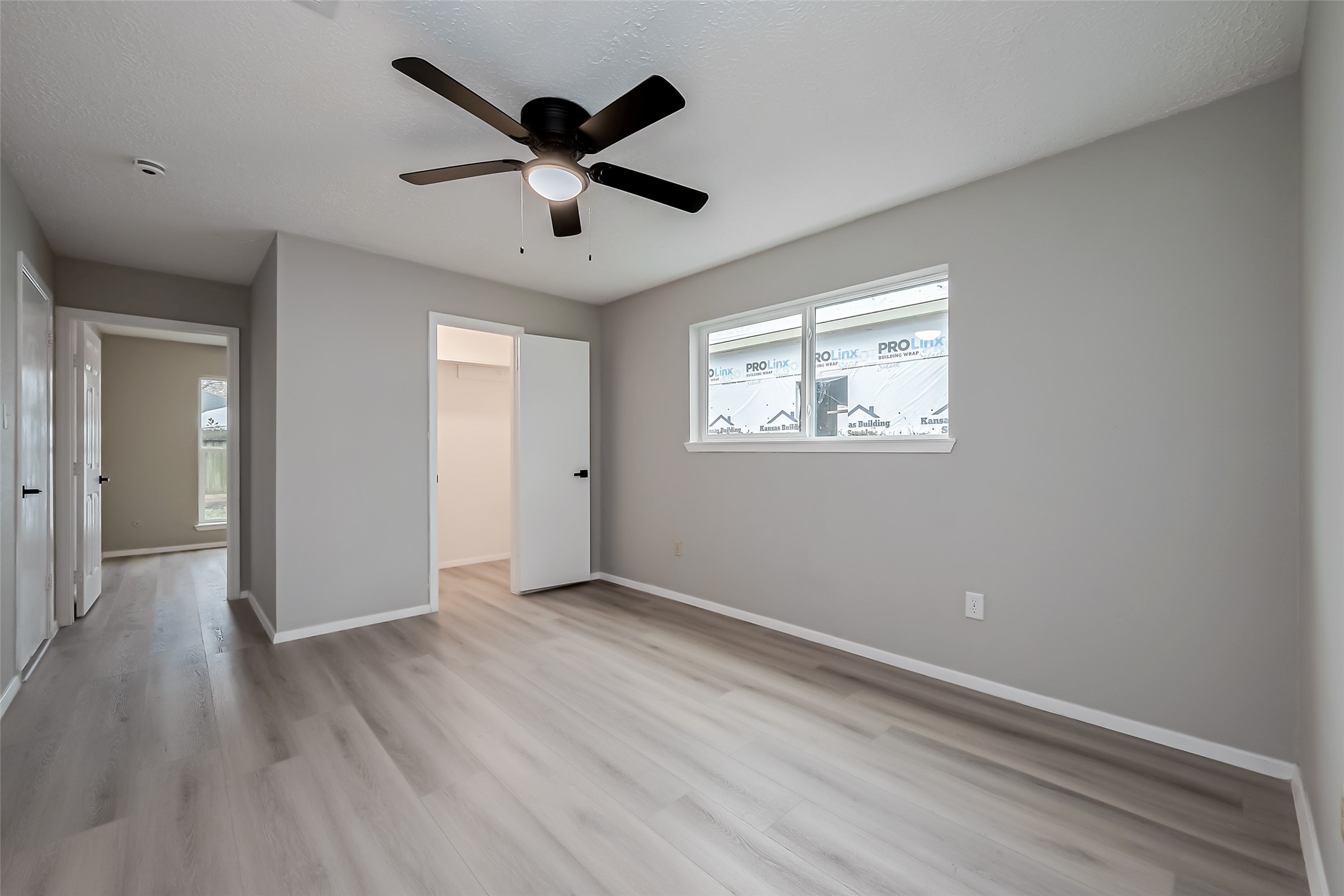 23227 Pine Post Lane Spring, TX 77373 - Photo 26 of 40 wooden floor in an empty room with a window