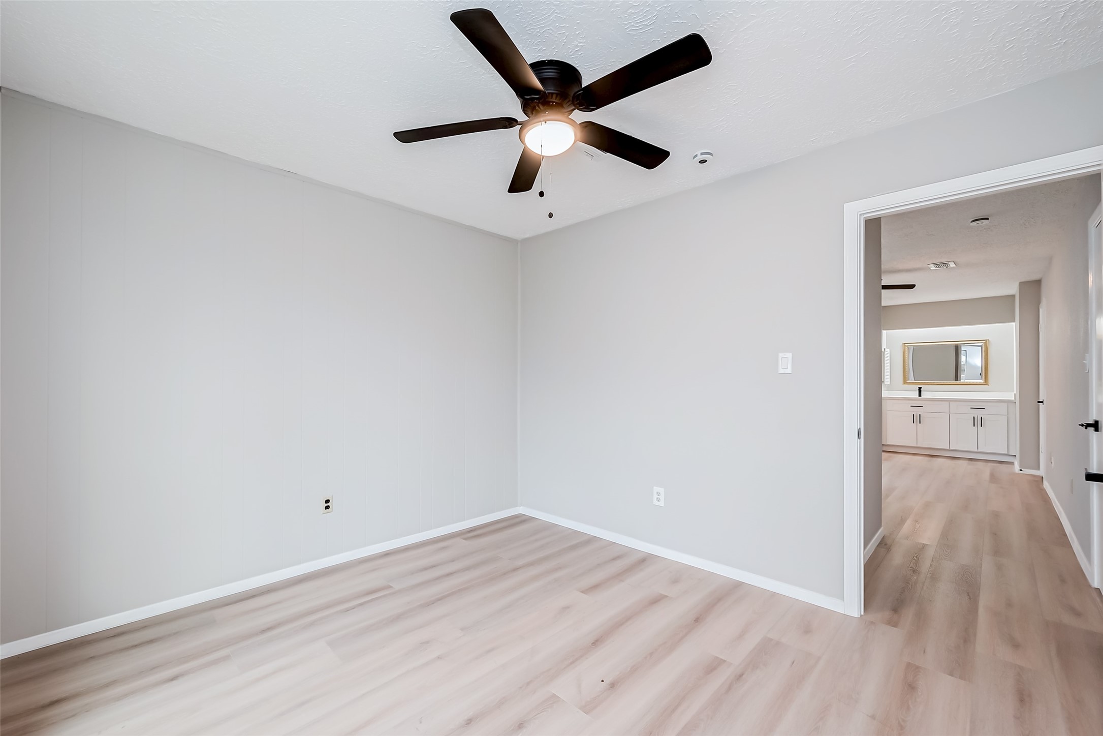 23227 Pine Post Lane Spring, TX 77373 - Photo 30 of 40 an empty room with wooden floor and ceiling fan