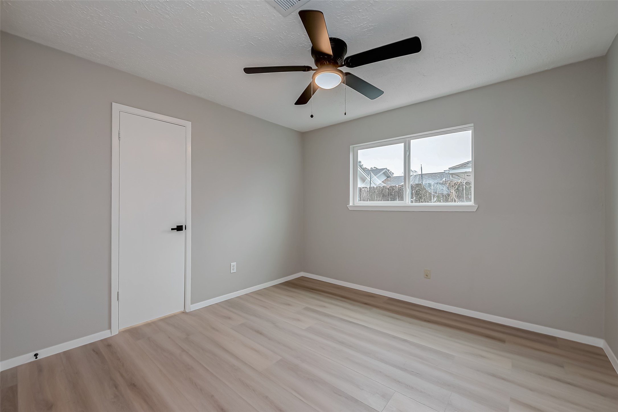 23227 Pine Post Lane Spring, TX 77373 - Photo 31 of 40 a view of empty room with wooden floor and window