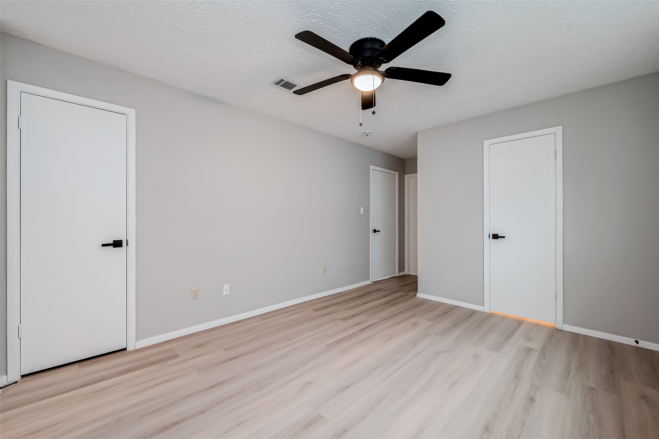 23227 Pine Post Lane Spring, TX 77373 - Photo 33 of 40 an empty room with wooden floor and ceiling fan
