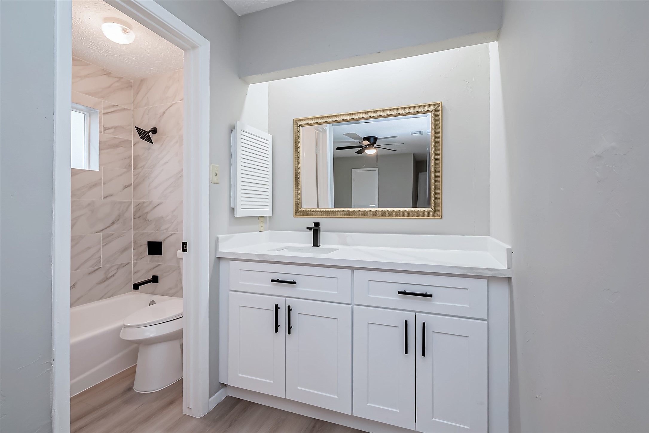 23227 Pine Post Lane Spring, TX 77373 - Photo 34 of 40 a bathroom with a toilet sink and mirror