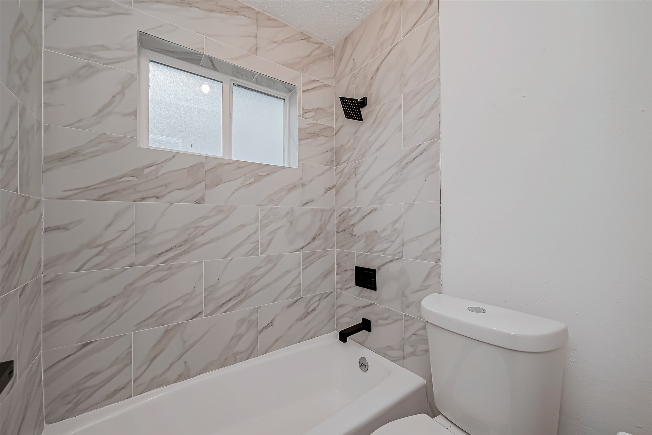 23227 Pine Post Lane Spring, TX 77373 - Photo 35 of 40 a bathroom with a bathtub and a toilet