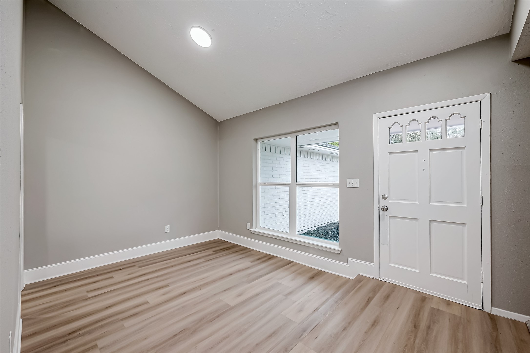 23227 Pine Post Lane Spring, TX 77373 - Photo 5 of 40 an empty room with wooden floor and windows