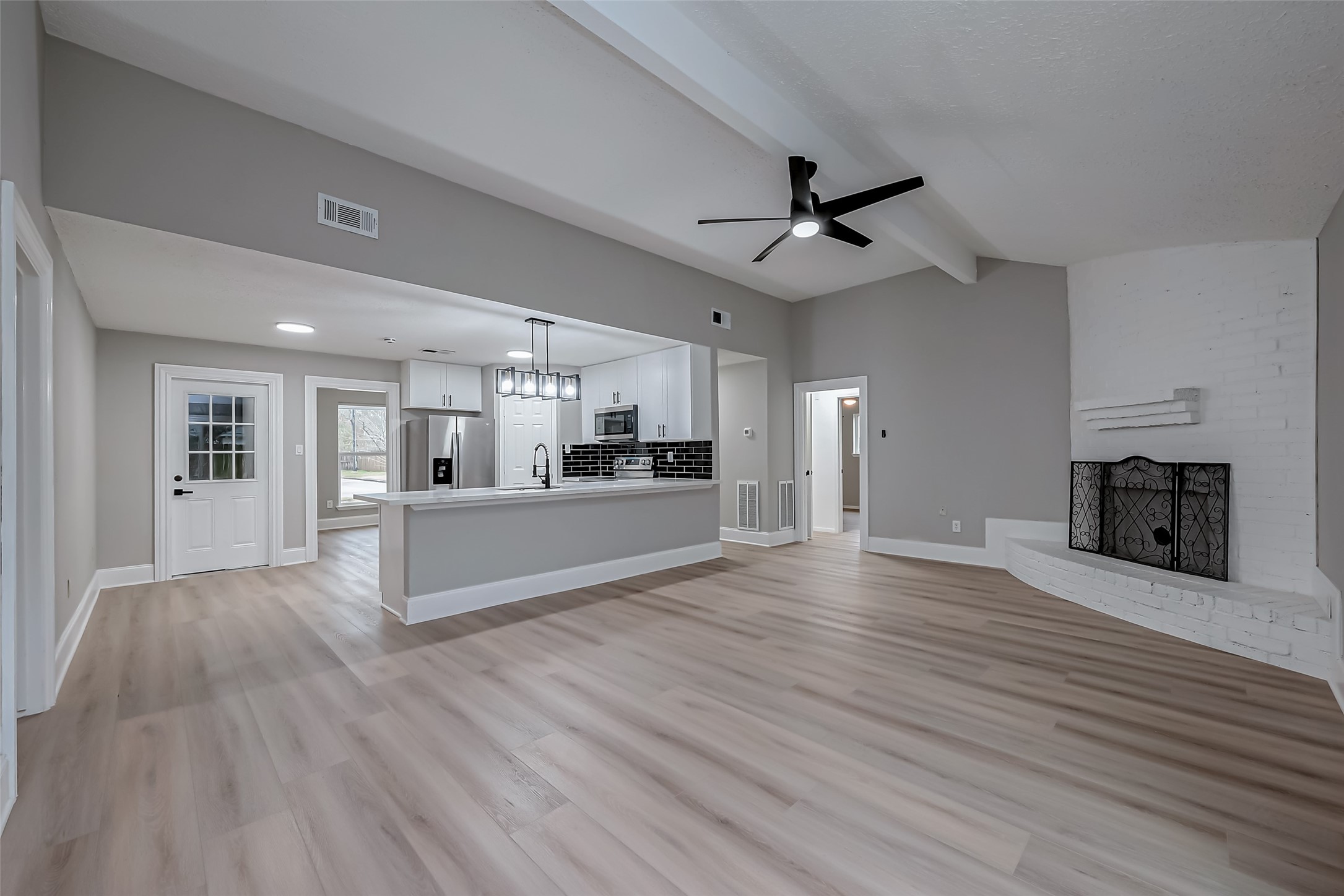 23227 Pine Post Lane Spring, TX 77373 - Photo 9 of 40 a view of kitchen and hall with wooden floor