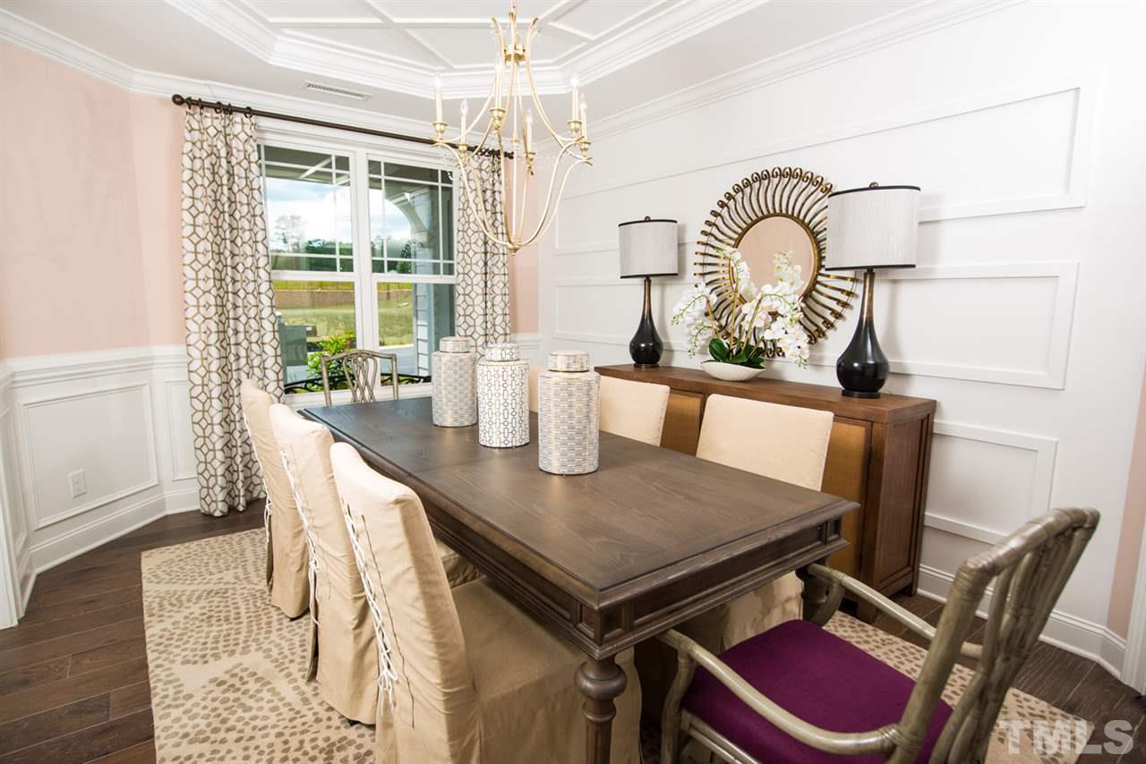 Beautiful tray ceiling with designer trim work, wainscoting and much more...