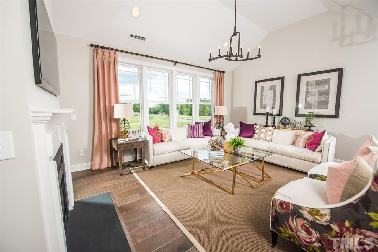 Spacious open family room adjacent to the kitchen and screen porch.